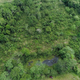 Aerial picture taken with a drone on September 25, 2017 showing a residual pool from a now abandoned oil well which was exploited by Texaco between 1964 and 1990, in Shushufindi, in the Ecuadorean Amazon forest. - A group of Canadian indigenous leaders and US activists toured contaminated areas of Ecuador's Amazonia on Monday, where the US oil company Chevron, which bought Texaco in 2001, was sentenced to pay 9.5 billion USD in compensation for the environmental damages.